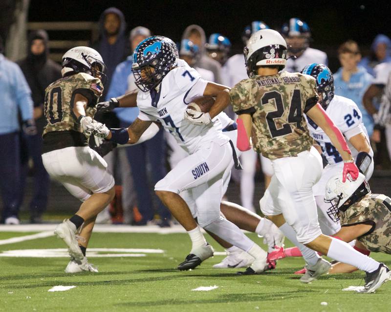 Downers Grove South's Keon Maggit runs for a gain against Addison Trail on Friday, Oct.25,2024 in Addison.
