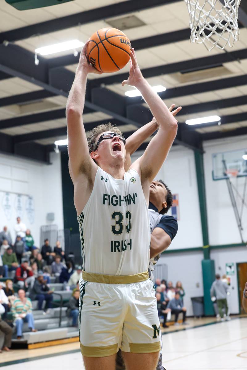 Bishop McNamara's Callaghan O'Connor goes for a layup during the Fightin' Irish's 70-51 loss to Hope Academy on Tuesday, Dec. 9, 2025
