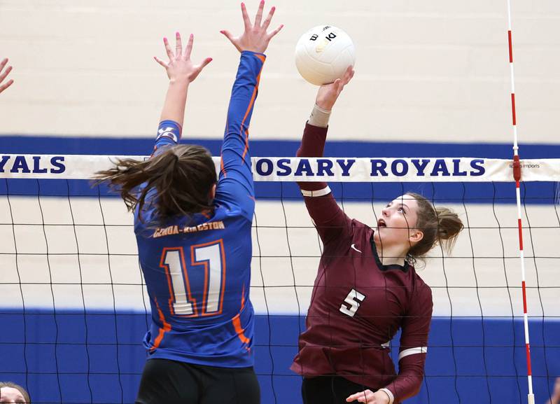 Marengo's Gianna Almeida tips the ball over Genoa-Kingston's Lily Mueller Thursday, Oct. 27, 2022, during their Class 2A Regional final match at Rosary High School in Aurora.