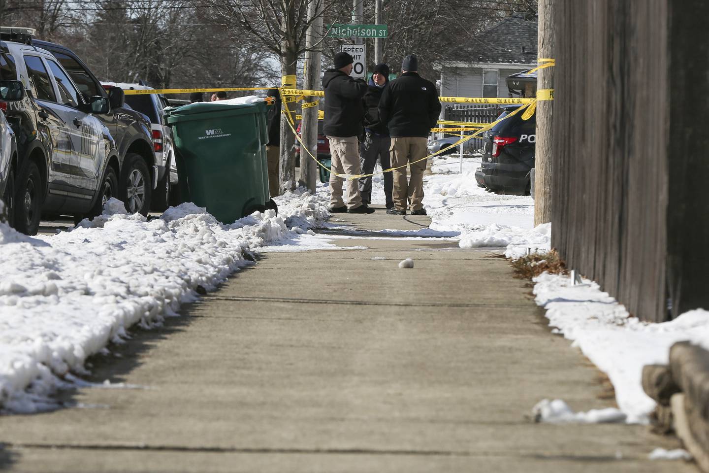 Police gather at the intersection of Ingalls Ave. and Nicholson St. after an officer involved shooting that took place on Thursday, Jan. 28, 2021, in Joliet, Ill.