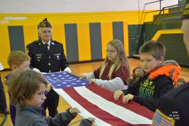 St. Juvin VFW presents flag protocol and meaning lesson at Coal City Intermediate School