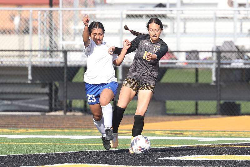 Joliet Central’s Jessenia Chavez works the ball away from Joliet West’s Julia Martinez on Tuesday, April 30, 2024.