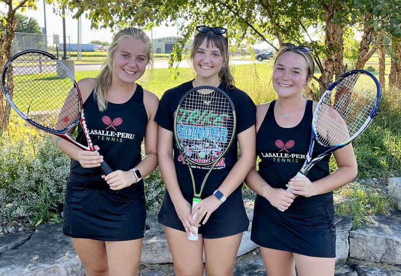 La Salle-Peru senior tennis players (left to right) Ava Lannen, Emmie Hachenberger and Izzy Pohar never played the sport before high school. Now, they enjoy it and are having success for the Cavaliers, who are 8-2 in duals.