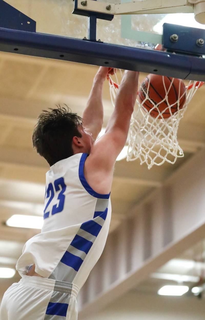 Princeton's Noah LaPorte  throws down a dunk against Dixon Tuesday night at Prouty Gym. The Tigers won 60-52.