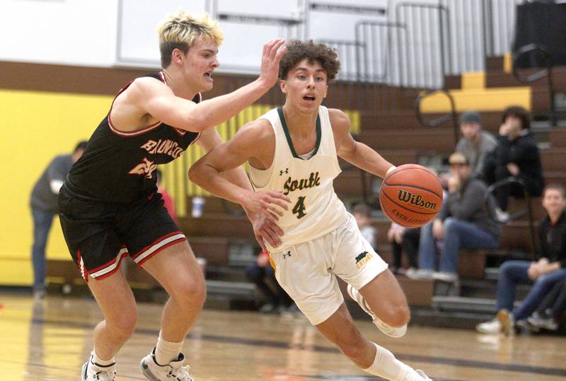 Crystal Lake South’s AJ Demirov, right, drives as  Barrington’s Nick Peipert defends in Hinkle Holiday Classic boys basketball tournament game action at Jacobs High School Tuesday.