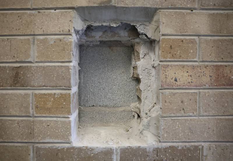 A hole remains in a wall at Grompers Junior High School where a time capsule was found on Wednesday, May 1, 2026 in Joliet. In 1969 students placed items in a time capsule and sealed it inside a wall when an extension was built at Grompers Junior High School.