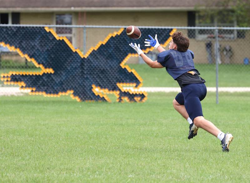 Hiawatha’s Colby Wylde lays out to try and catch a pass Tuesday, Aug. 19, 2025, during practice at the school in Kirkland.