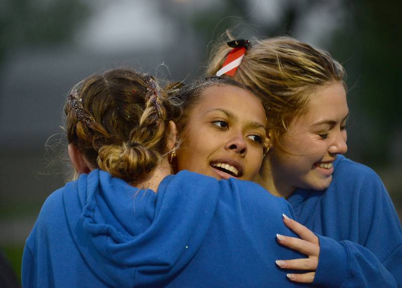 Forreston-Polo's Letrese Buisker gets a big hug from two of her teammates after qualifying for the state meet during the 1A Winnebago Sectional on Friday, May 12.