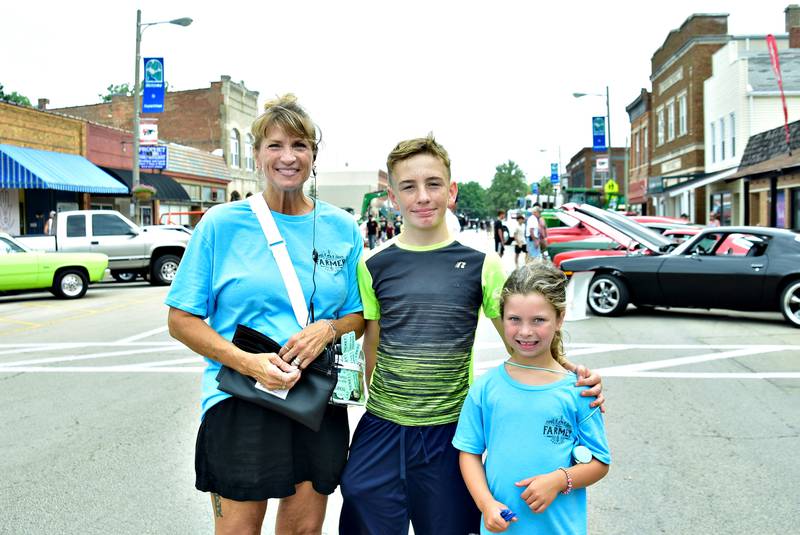 Tammy Zigler (left), Leeland Stenros and Loretta Anderson got their steps in Saturday, August 9, 2025 walking all over Washington Street in Prophetstown selling 50/50 raffle tickets during the inaugural Make a Farmer festival.