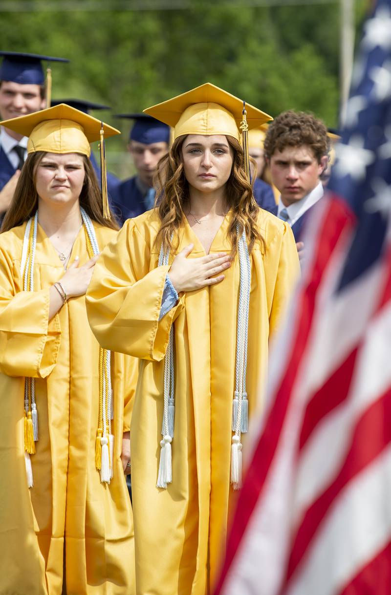 Madison Howard reacts to the surprise of seeing her brother, Austin Howard, present the flag Sunday, May 29, 2022, at Gould Stadium.