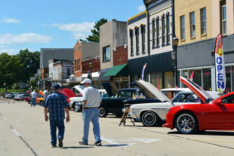 People wander down East Mason Street in Polo during the 35th annual Polo Car Show on Saturday, Aug. 10, 2024.