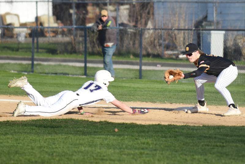 Reed-Custer's Collin Monroe, right, fields a pickoff throw at first base as Manteno's Brady Hespen dives back during a game at Manteno Monday, April 14, 2025.
