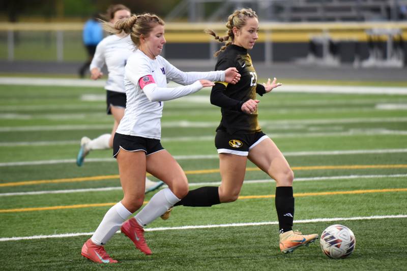 Herscher's Sophie Venckauskas, right, gets past Manteno's Abby Thorne and eyes a shot during a game at Herscher Tuesday, May 5, 2026.
