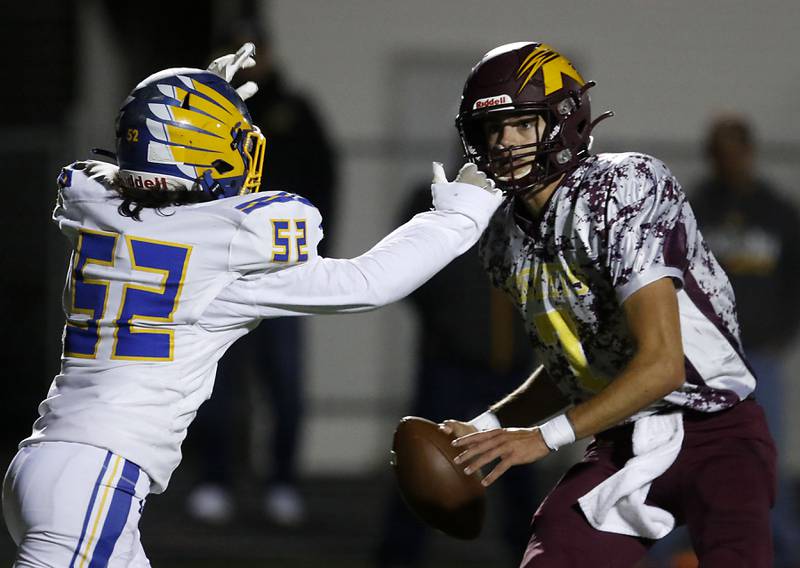 Johnsburg's Dominic Vallone pressures Richmond-Burton's Joe Miller during a Kishwaukee River Conference football game Friday, Oct. 7, 2022, between Richmond-Burton and Johnsburg at Richmond-Burton Community High School in Richmond.