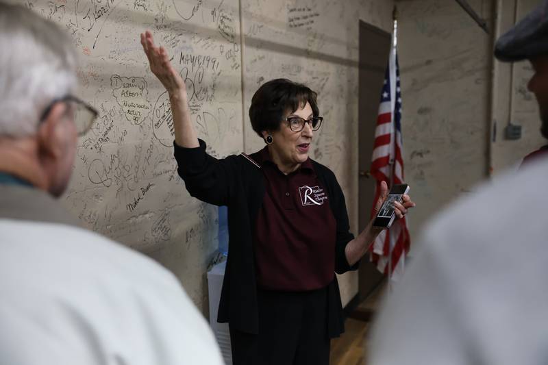 Marie Lynch, a volunteer at the theater for 25 years, gives a tour of the green room at the Rialto Theater’s 100th anniversary celebration on Sunday, May 3, 2026 in Joliet.