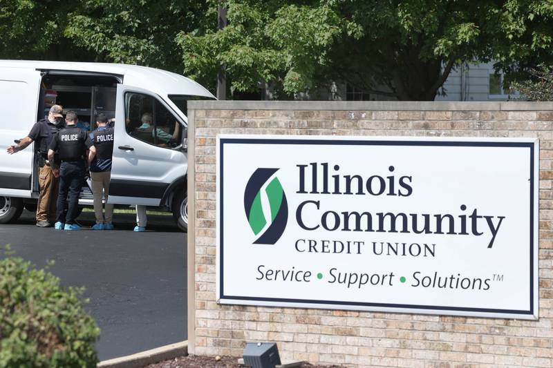DeKalb Police officers work outside the Illinois Community Credit Union Wednesday, July 31, 2024, as they investigate a morning bank robbery in the facility at 1500 Barber Greene Road in DeKalb.
