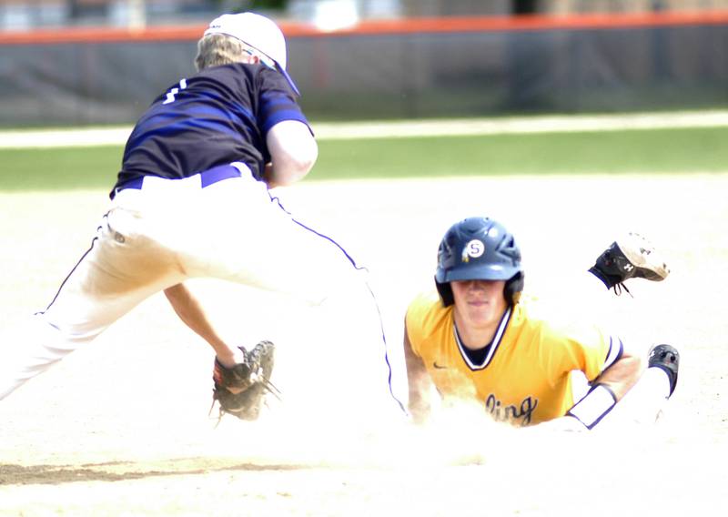 Sterling runner Wyatt Cassens slide safely back into second base.Dixon defeated Sterling 10-2 to win the Freeport regional in Freeport on May 31st, 2025.