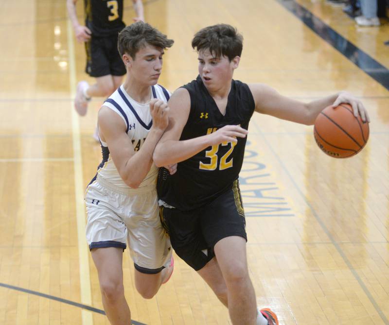 Ashton-Franklin Center's Nolan Rueff heads to the basket as Polo's Gus Mumford defends on Tuesday, Jan. 2, 2024 at Polo High School.