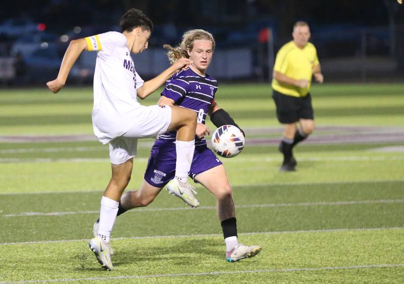 Mendota's Johan Cortez kicks the ball ahead of Peoria Christian's Quinton Hynek during the Class 1A Sectional game on Wednesday, Oct. 30, 2024 at Chillicothe High School.