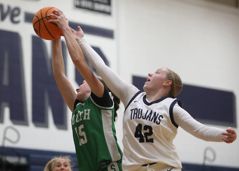 Crystal Lake South's Tessa Melhuish battles with Cary-Grove's Hannah McFaul for a rebound during a Fox Valley Conference girls basketball game on Tuesday, Dec. 2, 2025, at Cary-Grove High School in Cary.