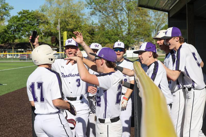 Manteno’s Brady Hespen, left, is celebrated by teammates s he returns to the dugout during the Panthers’ 8-7 victory over Herscher on Tuesday, May 6, 2025.