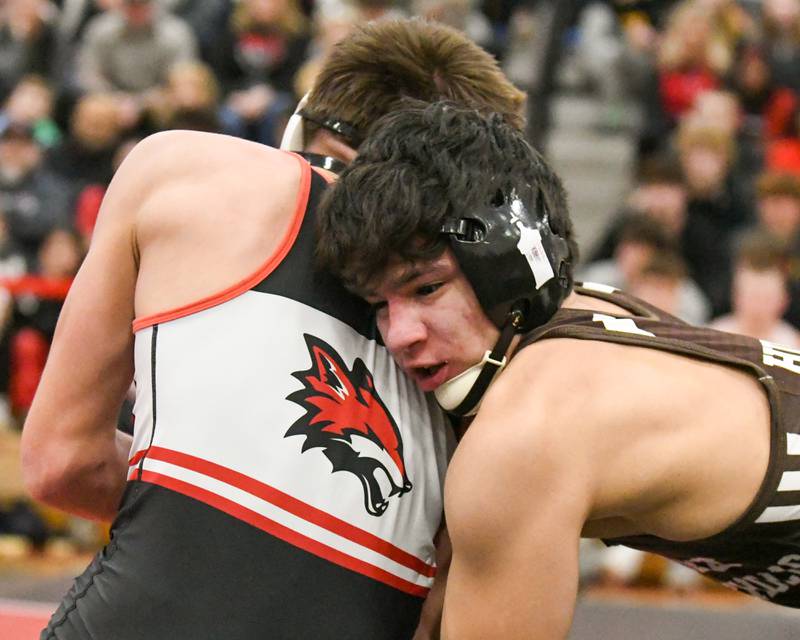 Aurelio Munzo of Joliet Catholic Academy keeps a hold of Vincent Konecki of Yorkville during the 132-weight class on Tuesday Feb. 25, 2025, held at Yorkville High School.