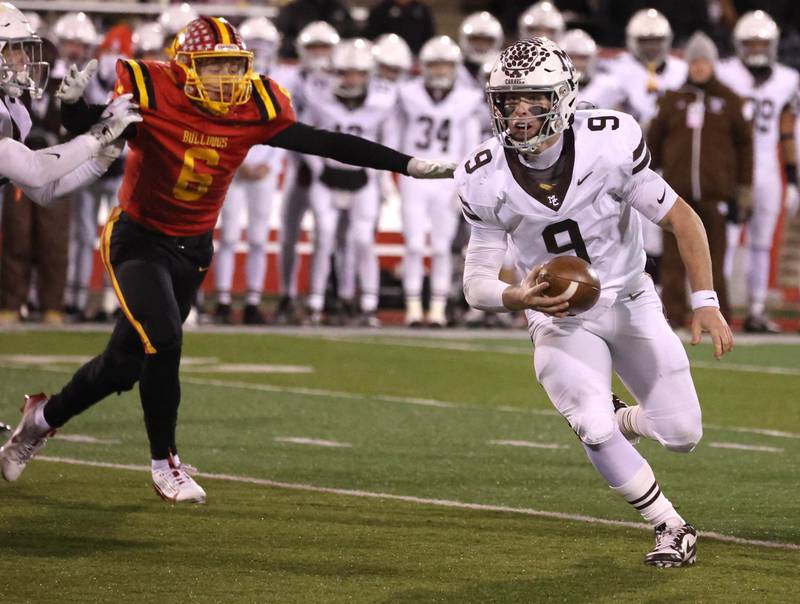 Mt. Carmel's Jack Elliott gets around the pressure of Batavia's Tony Minnec during their Class 8A state championship game Saturday, Nov. 30, 2024, in Hancock Stadium at Illinois State University in Normal.