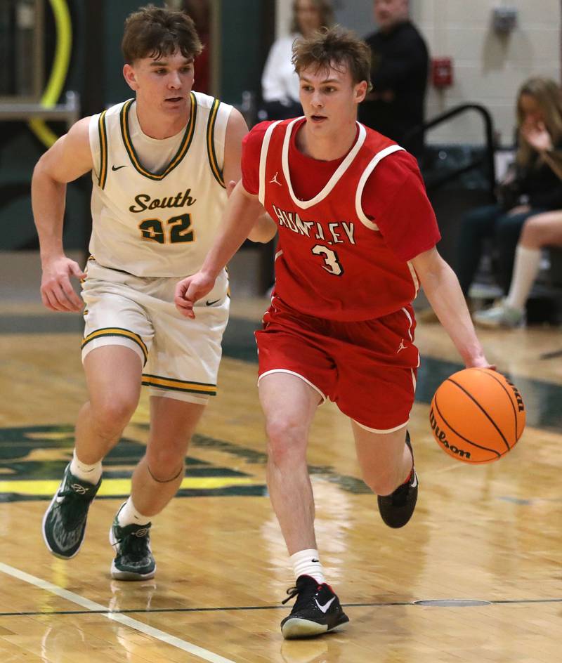 Huntley's Aidan Gibbs pushes the ball up the court agains Crystal Lake South's Nick Stowasser during a Fox Valley Conference boys basketball game on Friday, Jan. 30, 2026, at Crystal Lake South High School.