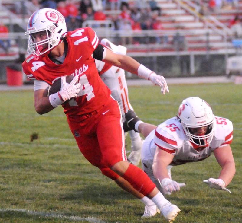 Ottawa's Archer Cechowiz eludes Streator's Cole Winterrowd for a touchdown on Friday, Sept. 5, 2025 at King Field.