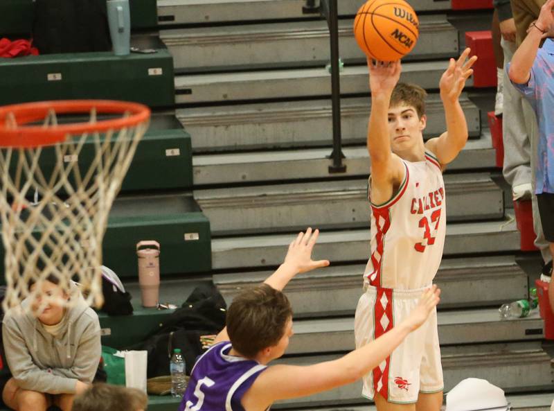 L-P's Gavin Stokes sinks a three-point basket over Rochelle's Mason Ludwig on Friday, Feb. 13, 2026 in Sellett Gymnasium at L-P High School.