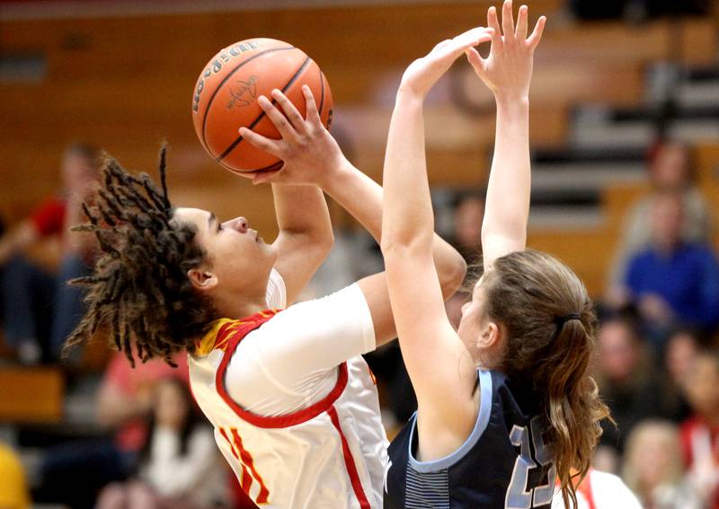 Batavia’s Addison Prewitt (left) shoots the ball during a home game against Lake Park on Tuesday, Dec. 6, 2022.