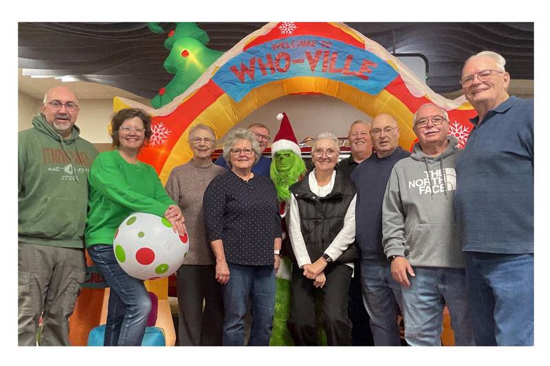 Ottawa Sunrise Rotary Club members had their picture taken with the Grinch at Bill Walsh Automotive Group and collected 121 toys and 33 books.