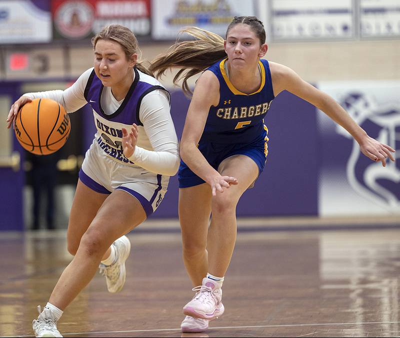 Dixon's Reese Dambman handles the ball against Aurora Central’s Grace Grunloh Thursday, Dec. 26, 2024, during the Dixon Girl’s KSB Holiday Basketball Classic.