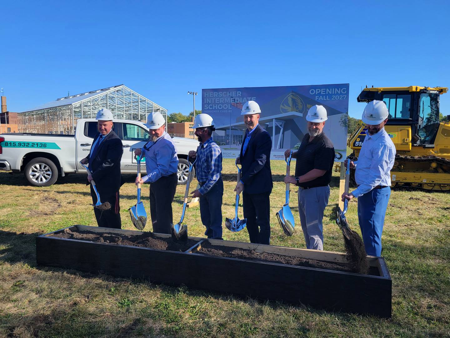 From left to right, Herscher Superintendent Rich Decman; Herscher School Board members Dustin Wright and Mark Regis; Jeff Downs of Johnson-Downs Construction; Doug Bright of Bright Architecture; and Douglas Draeger of BLDD Architects participate in a groundbreaking ceremony for the new Herscher Intermediate School building on Thursday, Oct. 9, 2025.