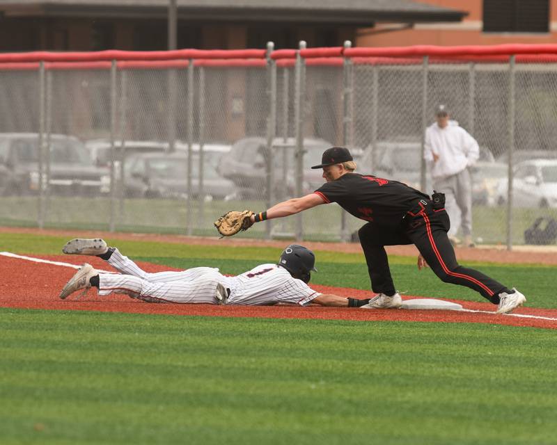 Yorkville's Frank Pavlik, right, checks up Romeoville's Jonny Lee (1) during the regional game on Thursday May 29, 2025, held at Yorkville High School.