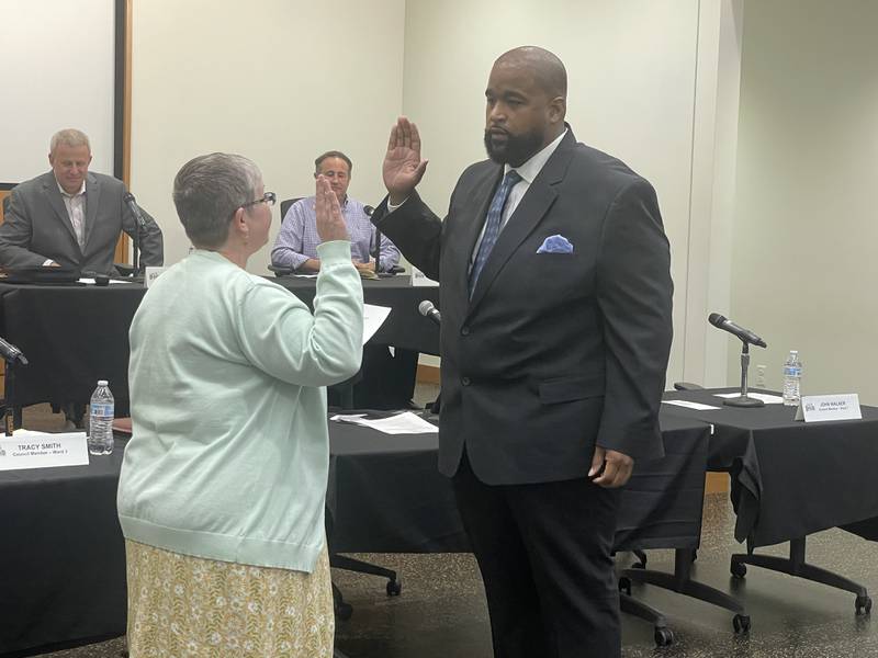 Barb Larson (right) is sworn in May 12, 2025, at the DeKalb City Council meeting.