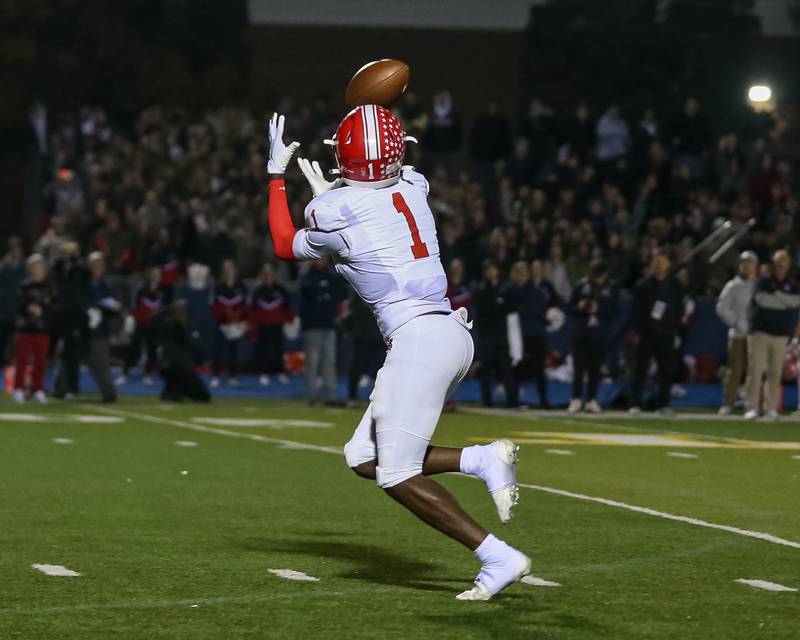 Naperville Central's DeShaun Williams (1) catches a second touchdown during Class 8A quarterfinal football game between Naperville Central at Lyons on Friday, Nov 15, 2024  in Western Springs.