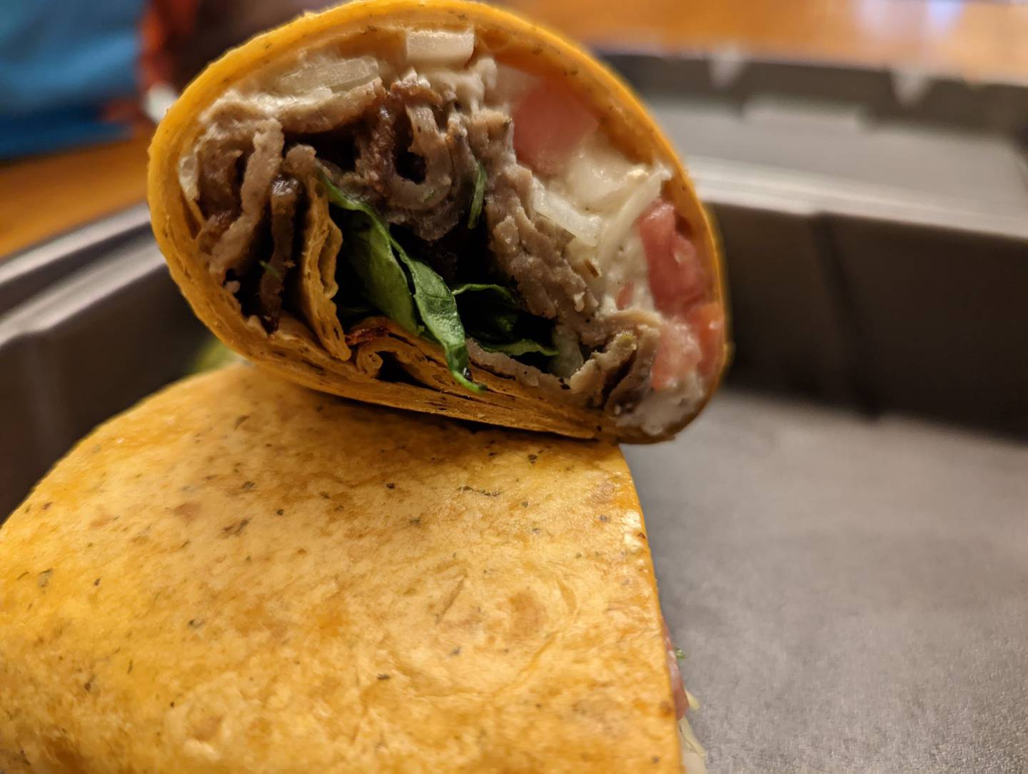 Pictured is the Mediterranean wrap for $9 at Happy Place Cafe in Shorewood. This wrap is filled with gyro meat, chopped lettuce, tomatoes, onions, feta cheese and Greek dressing.
