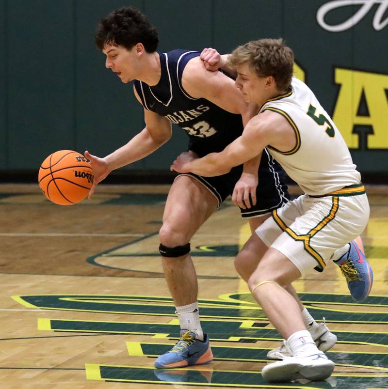 Crystal Lake South's Carson Trivellini tries to slow down Cary-Grove's Adam Bauer as she pushes the ball up the court during a Fox Valley Conference boys basketball game on Friday, Jan. 23, 2026, at Crystal Lake South High School.
