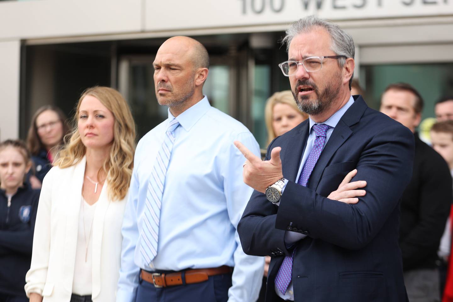 Brian Koch, right, a friend of Edward Goewey, center, speaks to the press outside Will County Courthouse during a press conference. Edward Goewey, a Will County sheriff’s deputy currently on medical leave, is being charged with disorderly conduct accusing him of disturbing Mokena school officials when he insisted on the removal of a student he believed made a shooting threat at St. Mary Catholic school. Monday, April 11, 2022, in Joliet.