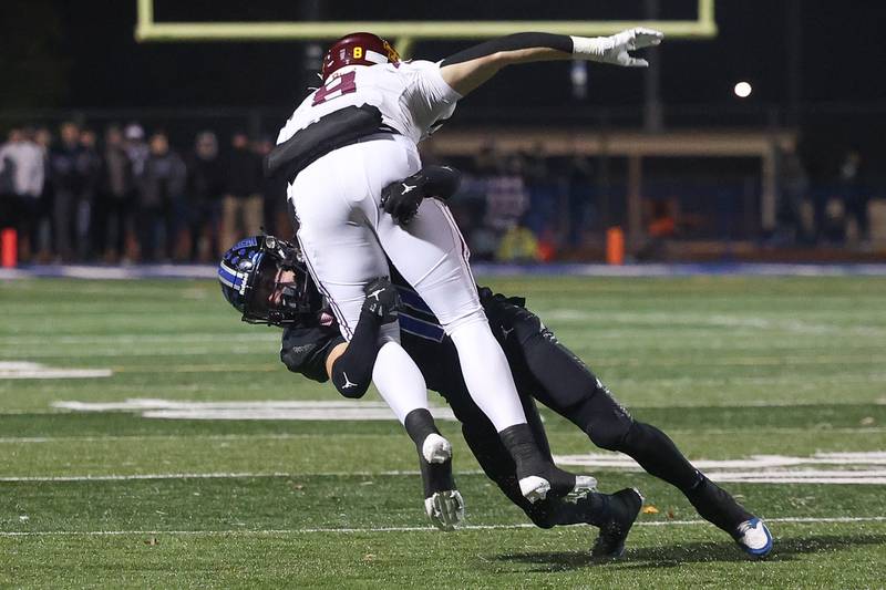 Lincoln-Way East’s Brayden Mortell wraps up Loyola’s Conlon Kane in the Class 8A semifinal on Saturday, Nov. 23, 2024 in Frankfort.