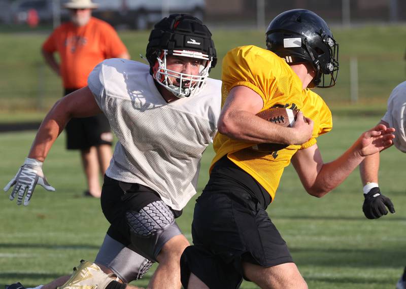 Byron’s Caden Considine pursues a Lena-Winslow ball carrier Thursday, July 24, 2025, during a joint practice with Byron, Lena-Winslow and Sycamore at Sycamore High School.