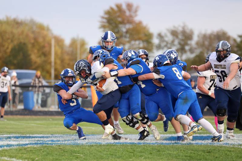 Clifton Central's Evan Cox, left, and a slew of Comet defenders bring down Knoxville's Brydon Walters during the Comets' 24-6 victory over Knoxville in the Class 1A first-round playoff game on Saturday, Nov. 1, 2025.