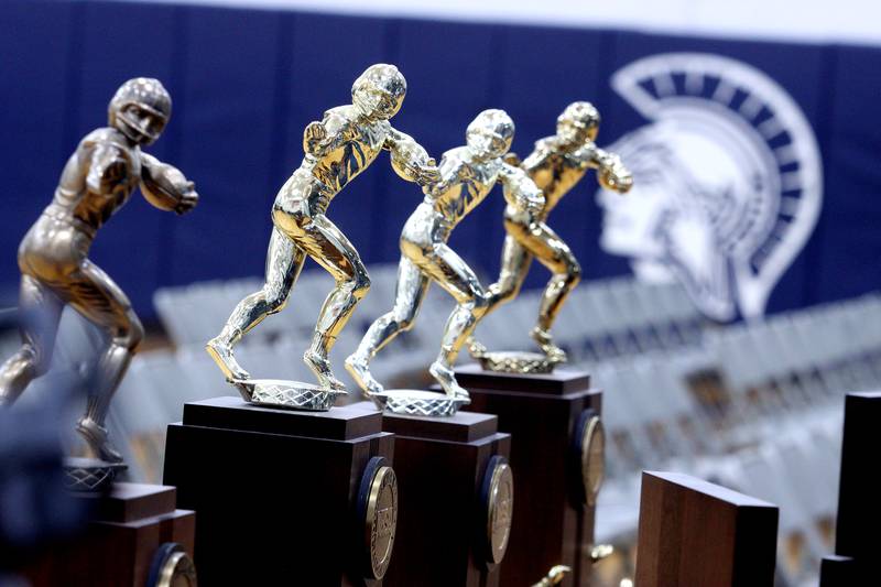 Hardware from Cary-Grove’s historic state tournament appearances were on display during a celebration of the 2023 IHSA Class 6A Champion Cary-Grove football team at the high school Sunday.