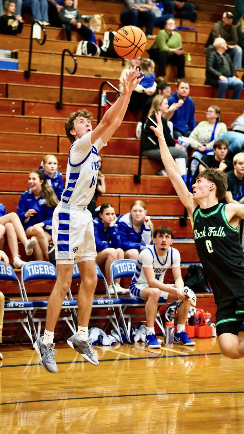 Princeton's Jackson Mason Jackson shoots a 3 over Rock Falls' Max Burns in Tuesday's game at Prouty Gym. The Rockets won 61-58.