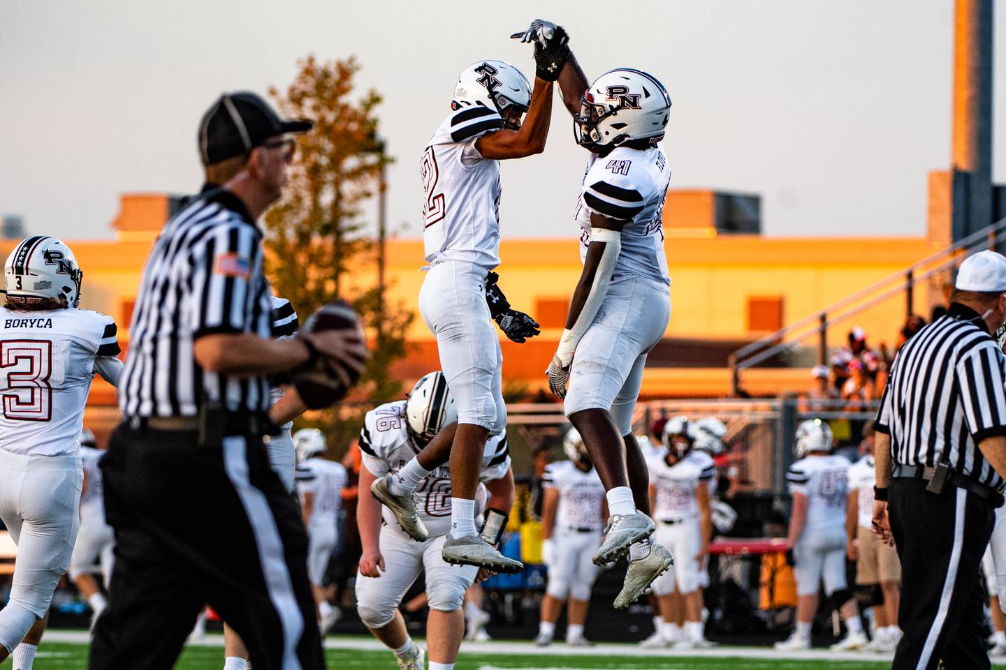 Plainfield Norths Sean Schlanser and Gerald Floyd celebrate a touchdown during a game against Plainfield East  Friday, Aug. 26 2022 at Plainfield East