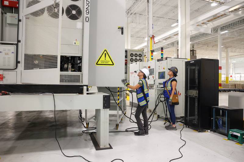 Workers prepare an energy-storage unit at Gotion Illinois in Manteno on Oct. 1, 2025. About 25% of the workforce at the battery manufacturing plant is female, according to Gotion's Public Relations staffer Andy Wheeler.