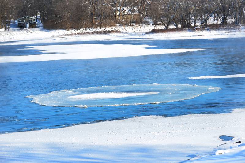 A circle of ice floats on the Rock River below the Oregon dam on Sunday, Jan. 14, 2024 as temperatures plunged to -13 Saturday night and remained throughout the day. The frigid weather followed a winter storm on Friday that deposited 10-13 inches across the region.