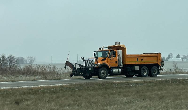 A Illinois Department of Transportation snow plow travels westbound on Monday, Dec. 2, 2024 along Interstate 80 in Bureau County. A light dusting f snow was enough for plows to be dispatched on the roadways.