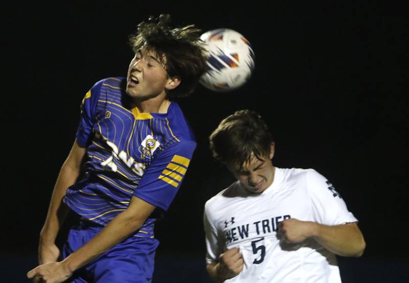 Lyons Township's Jimmy Brejcha heads the ball away from New Trier's Harrison Hahner during the IHSA Class 3A state championship soccer match on Saturday, Nov. 4, 2023, at Hoffman Estates High School.